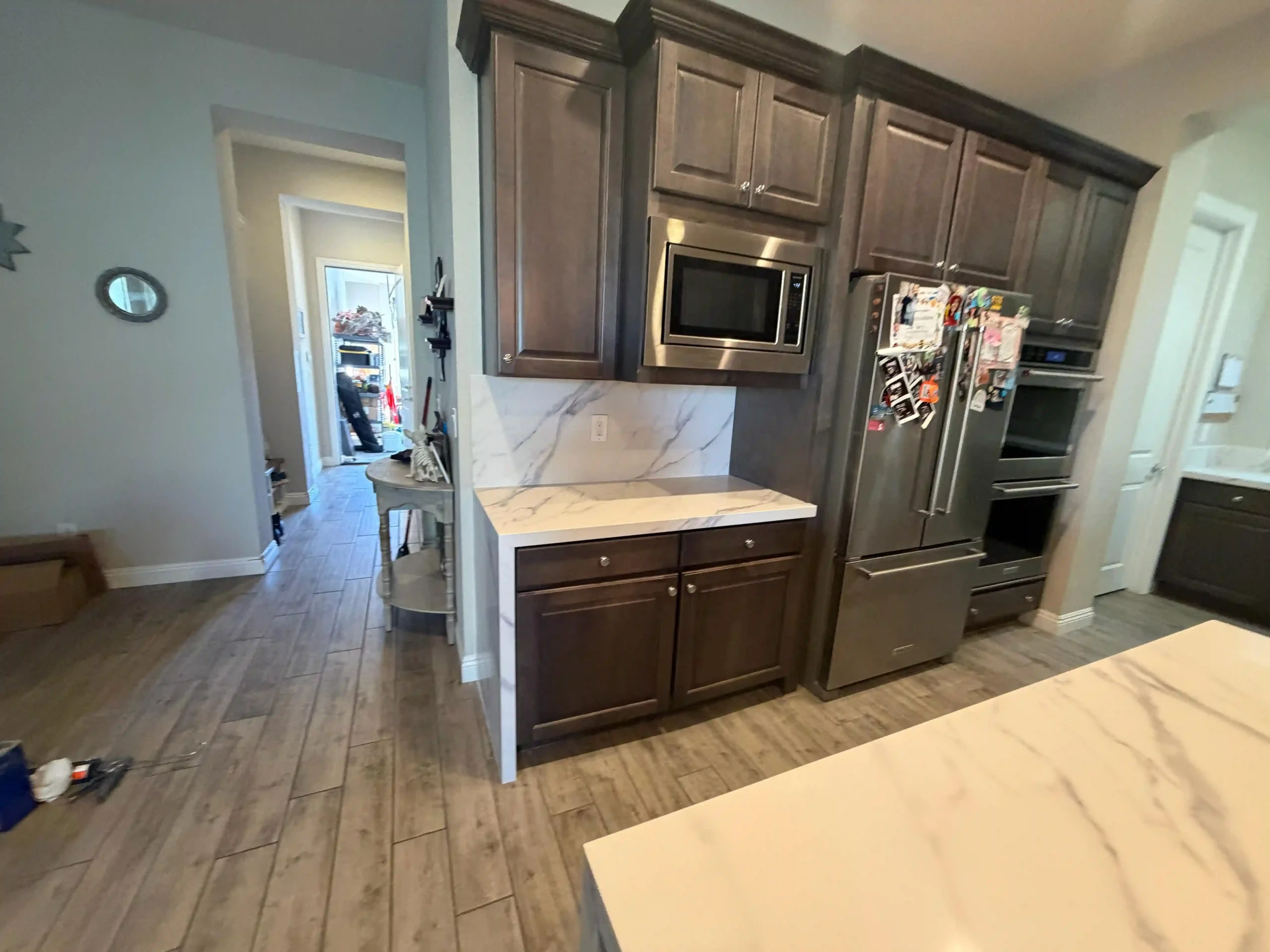 Kitchen remodel featuring island and stainless steel appliances by Pro Vegas Home Remodel