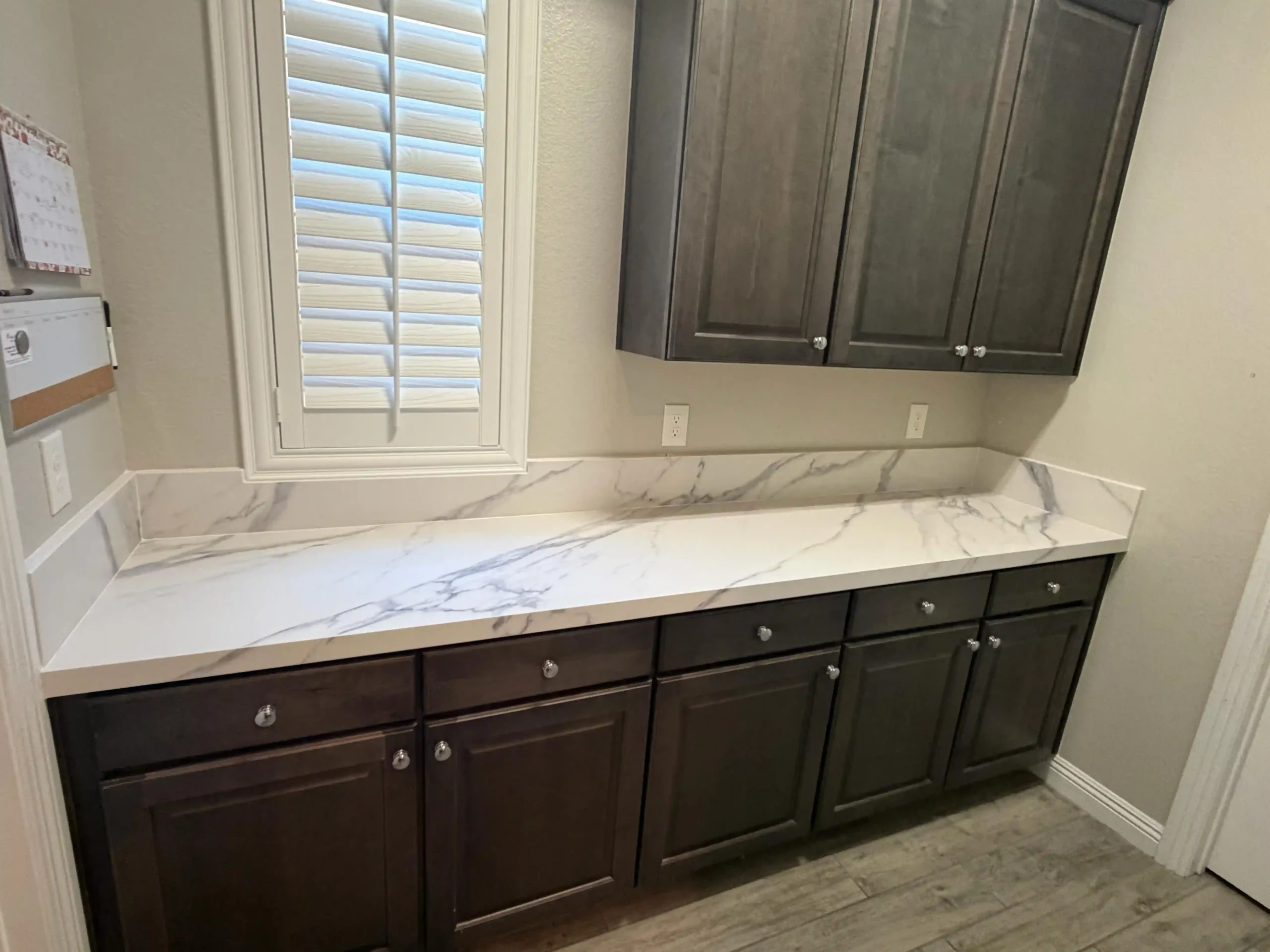 Custom kitchen counter with lower cabinets and window shutters designed by Pro Vegas Home Remodel