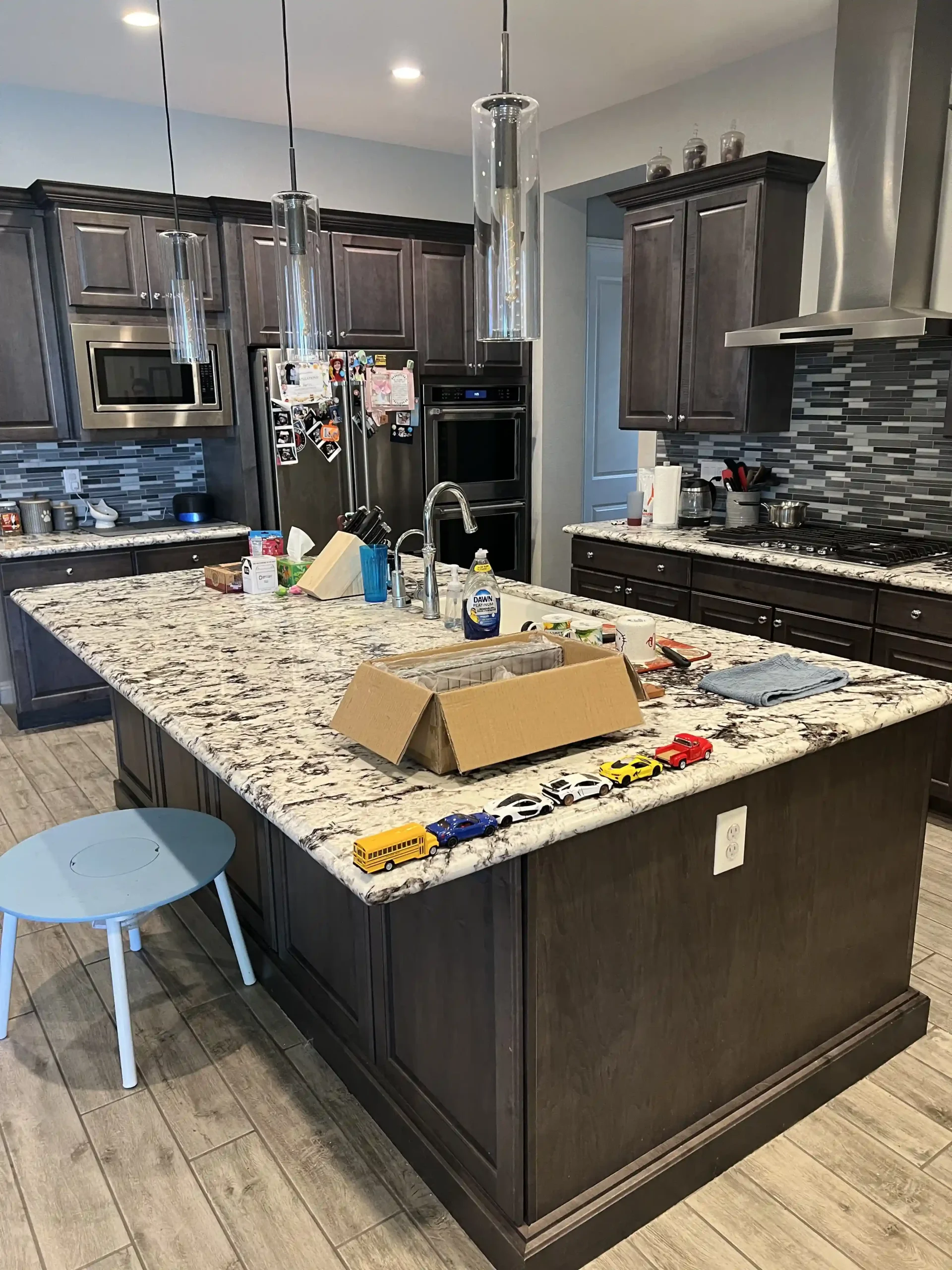 Kitchen island installation with stone countertop during remodel by Pro Vegas Home Remodel