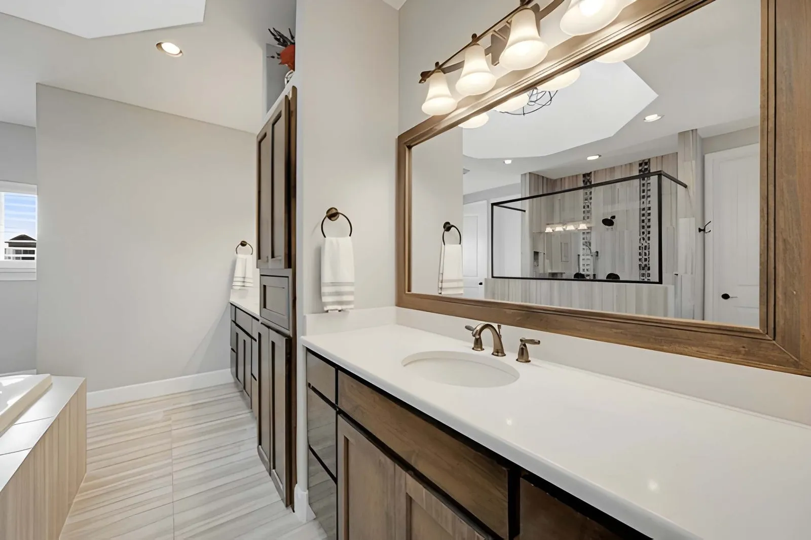 Kitchen and Bathroom Remodeling in Las Vegas displaying a spa-inspired bathroom renovation with modern fixtures and elegant lighting in Spring Valley