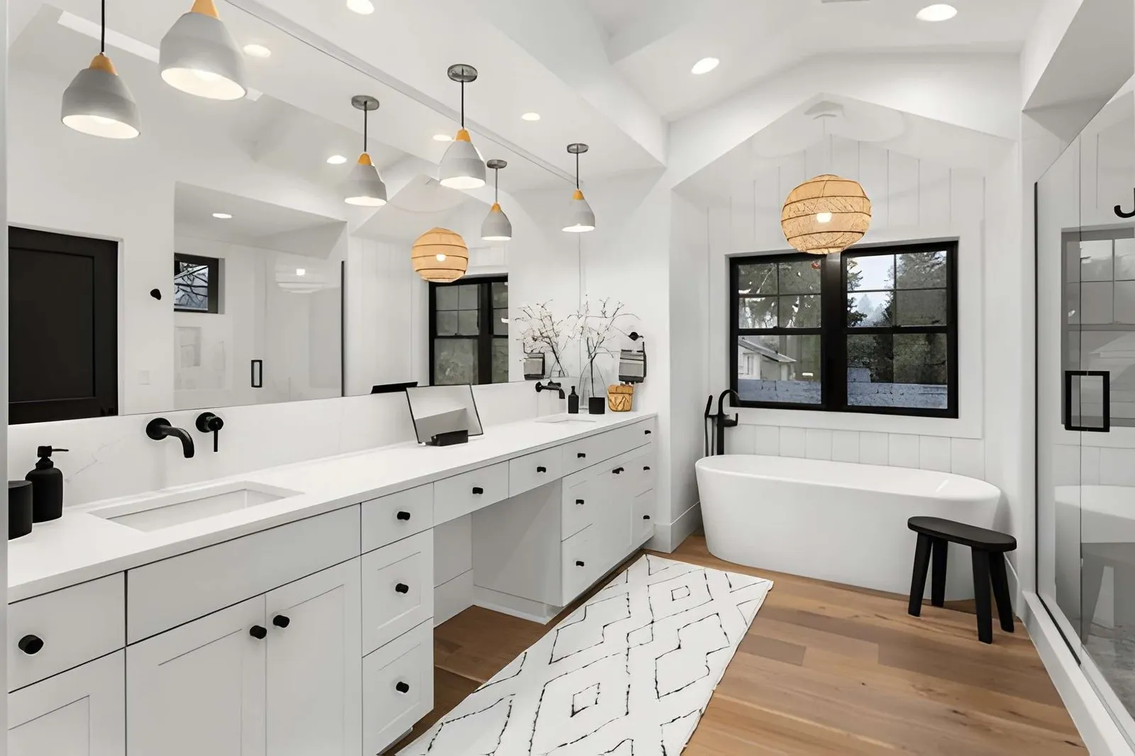 Kitchen and Bathroom Remodeling in Boulder City displaying a double vanity bathroom with modern fixtures and warm lighting